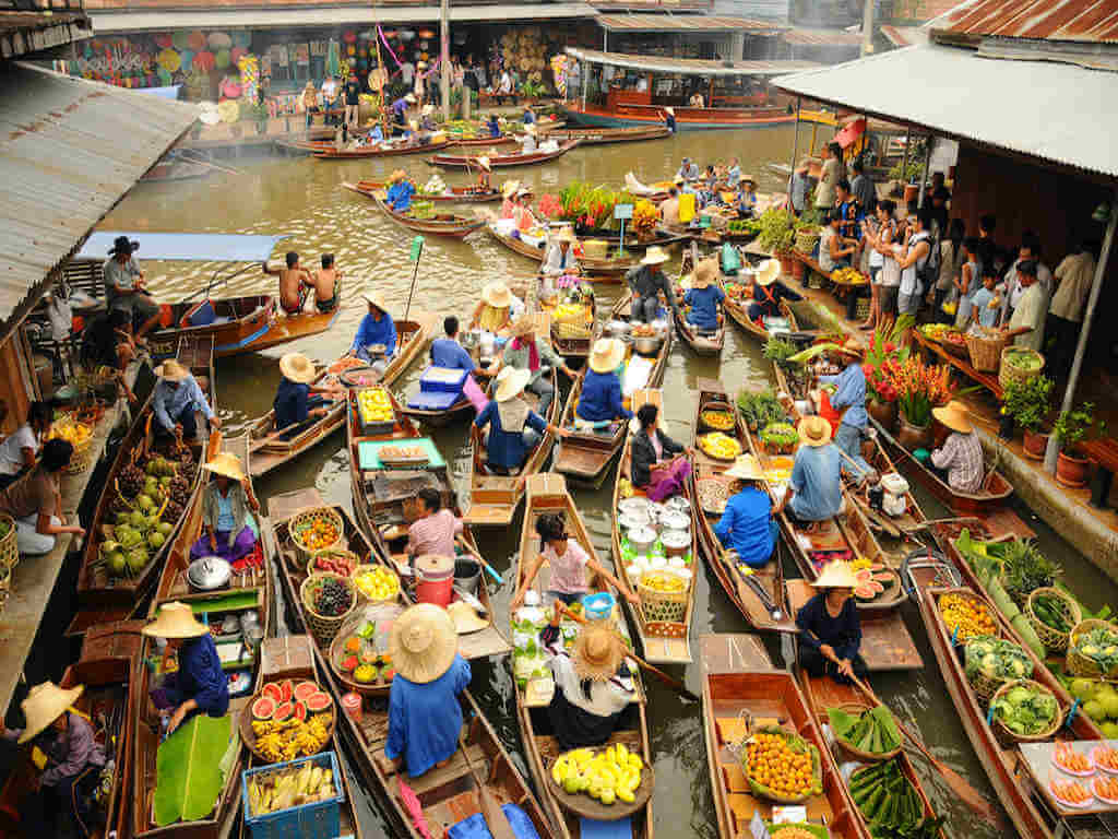 Wooden boats at Amphawa floating market – by nimon_Shutterstock.com